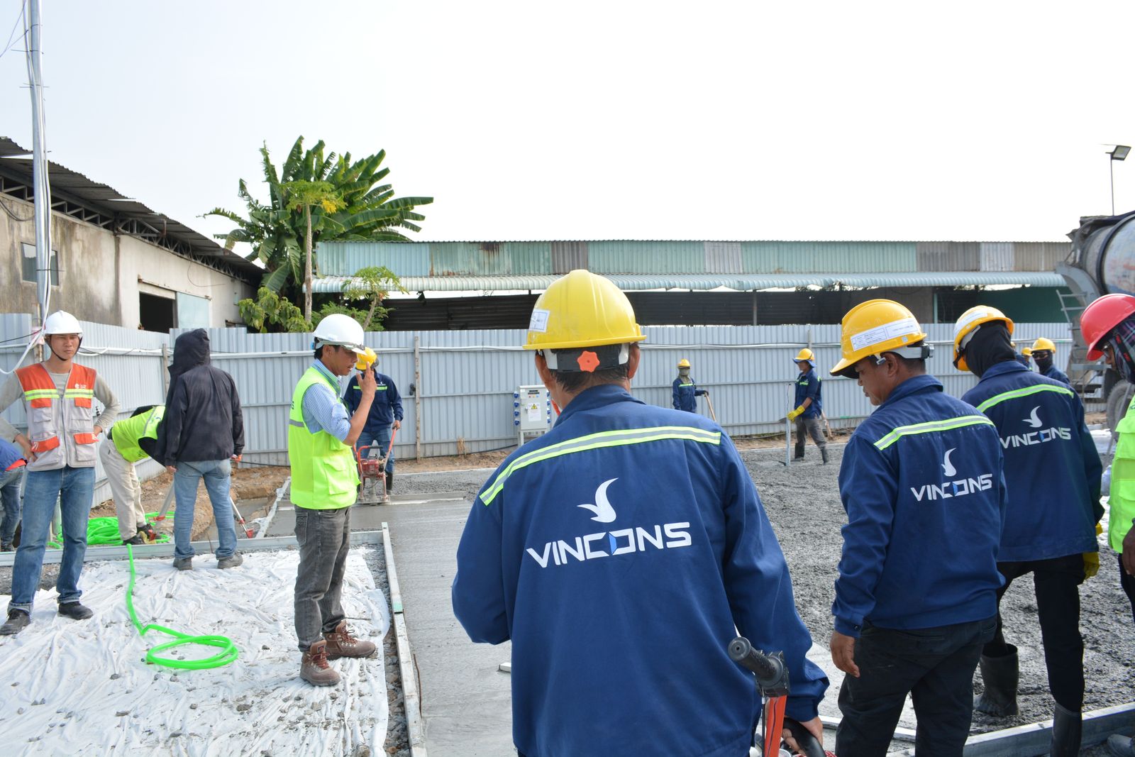 StormReady crew in hard hats reviewing a job site